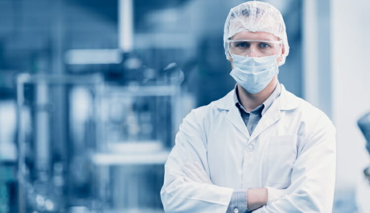 scientist standing in a cleanroom