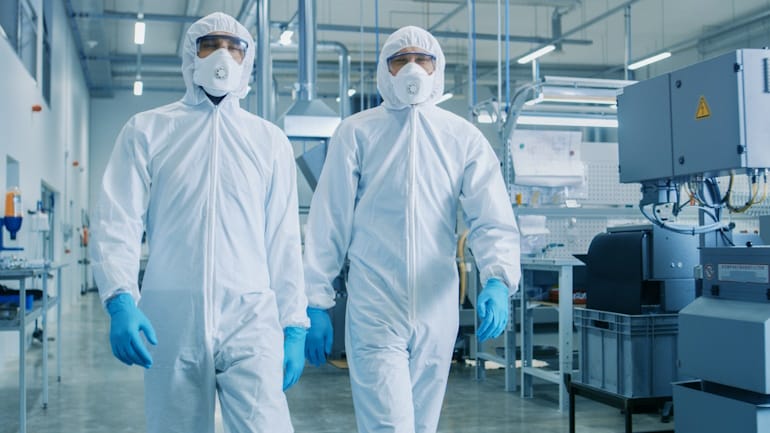 cleanroom workers in hazmat suits